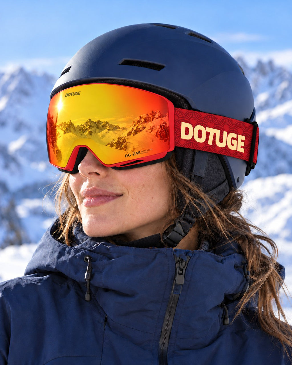 Orbit 2 | Snow Goggles | Photochromic Spherical Lens, UV400 Protection | Skiing and Snowboarding-Red Lens / Red Frame / Red Strap – worn with a ski helmet, close-up – Snowgest